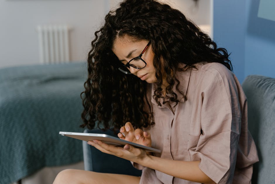 A person reading reviews on a tablet, focusing on the screen - heating and air conditioning reviews A person reading reviews on a tablet, focusing on the screen - heating and air conditioning reviews