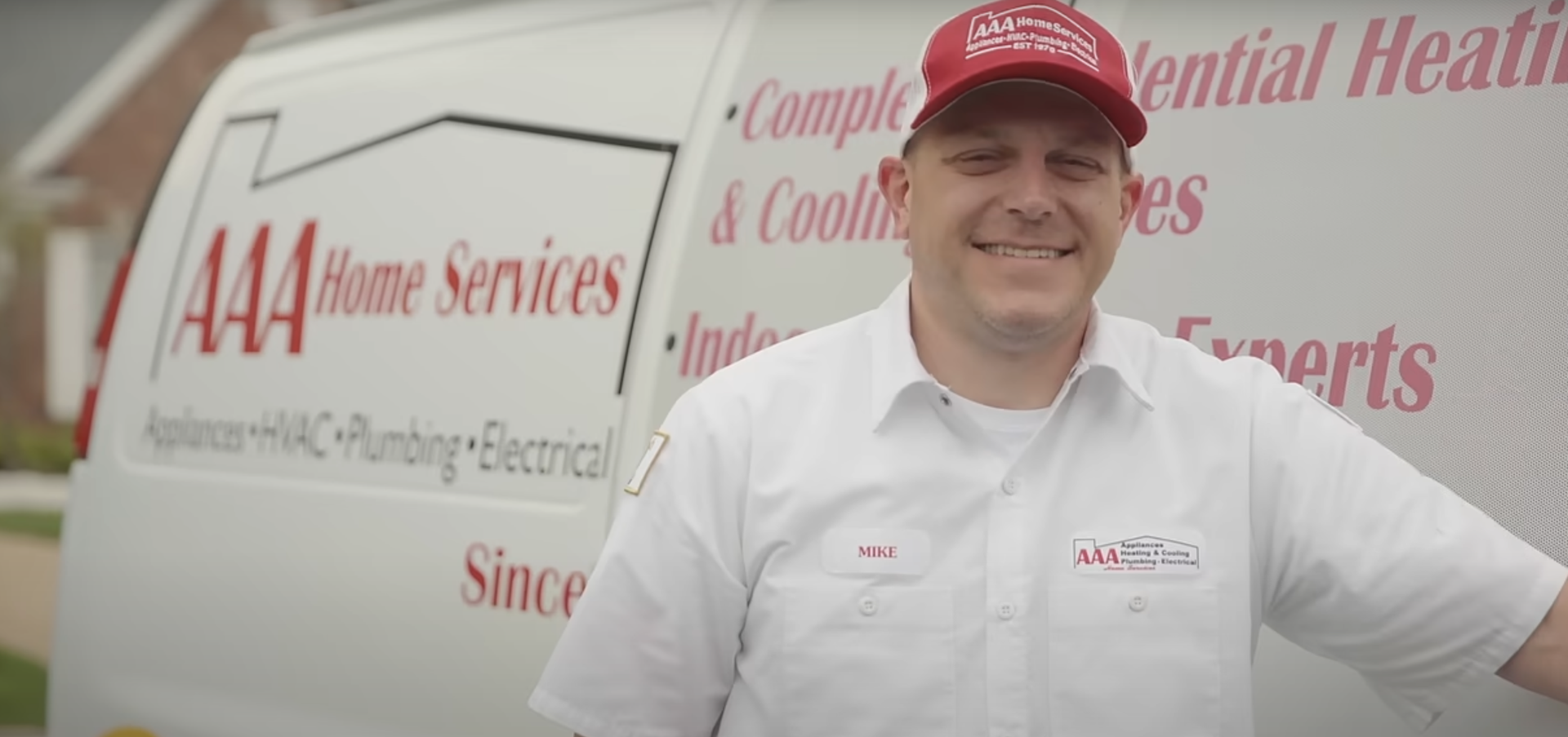 friendly AAA Home Services technician smiling at the camera - home heating and cooling friendly AAA Home Services technician smiling at the camera - home heating and cooling